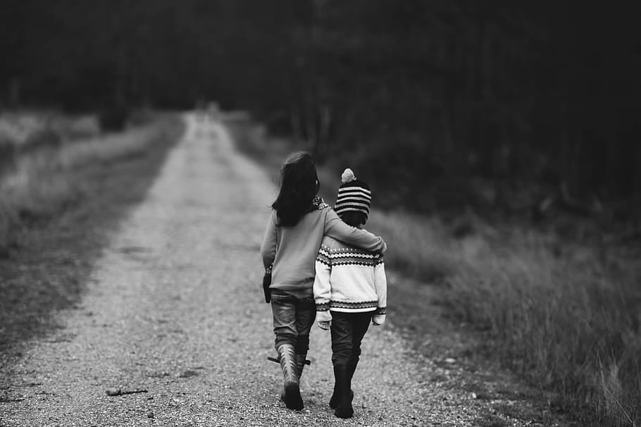 grayscale photography of kids walking on road, grayscale photography of two children walking on pathway