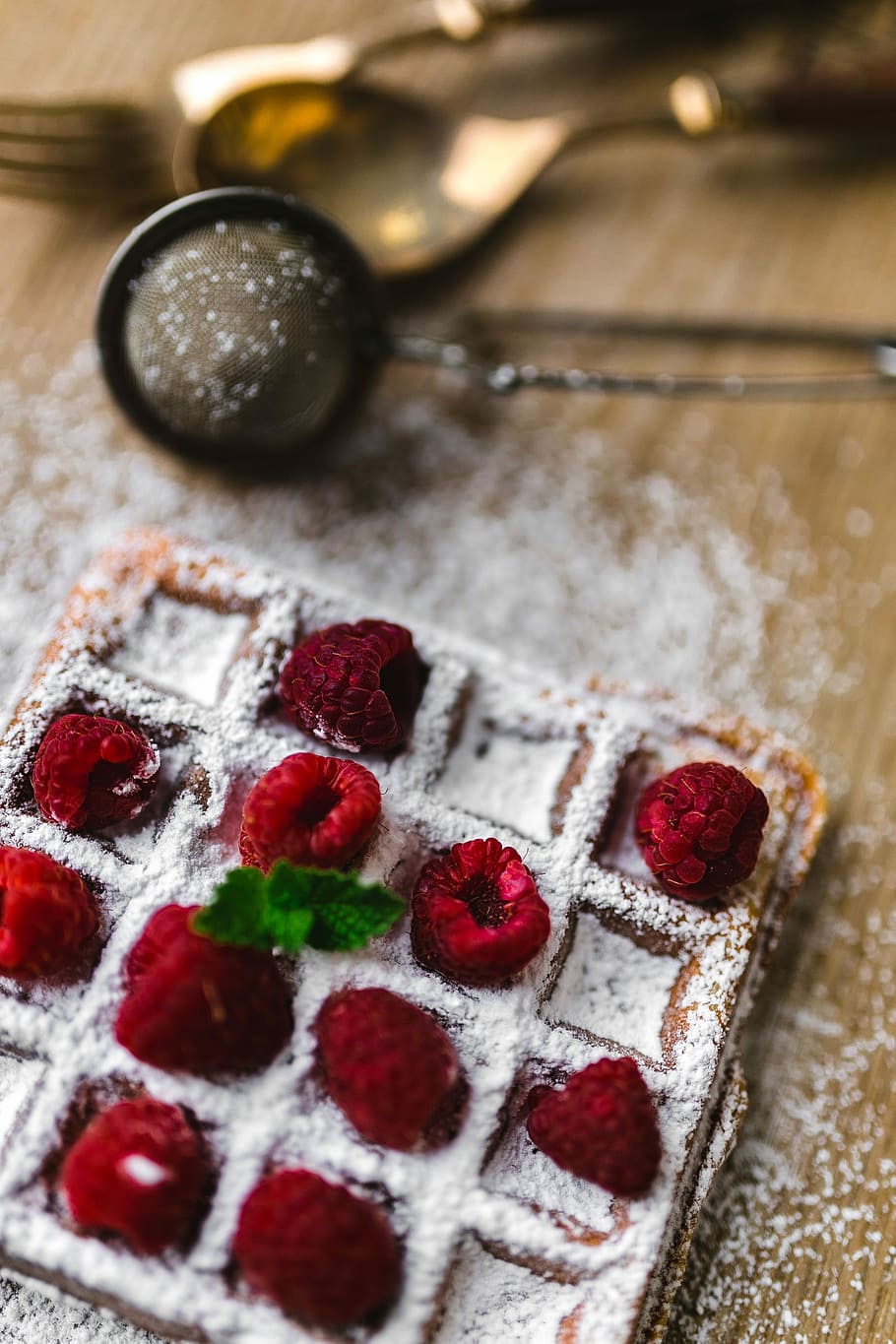 Breakfast waffles with fresh raspberries and powdered sugar, fruit