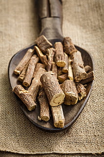 close-up photography of beige cut log, licorice, root, herbal HD wallpaper