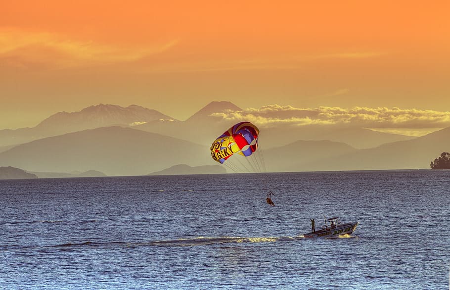 person parasailing during dusk, lake taupo, new zealand, north island, HD wallpaper