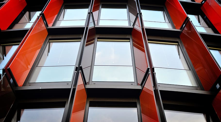 concrete structure with black metal frame clear glass panel windows HD wallpaper