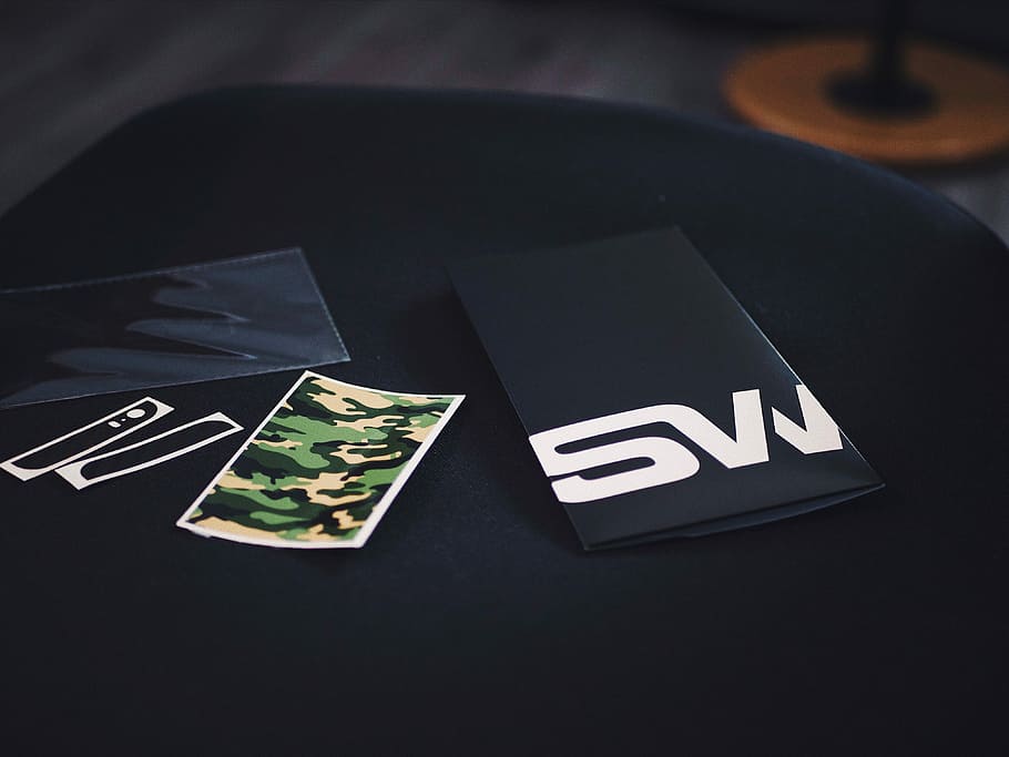 black textile on black surface, woodland camouflage sticker, phone decal HD wallpaper