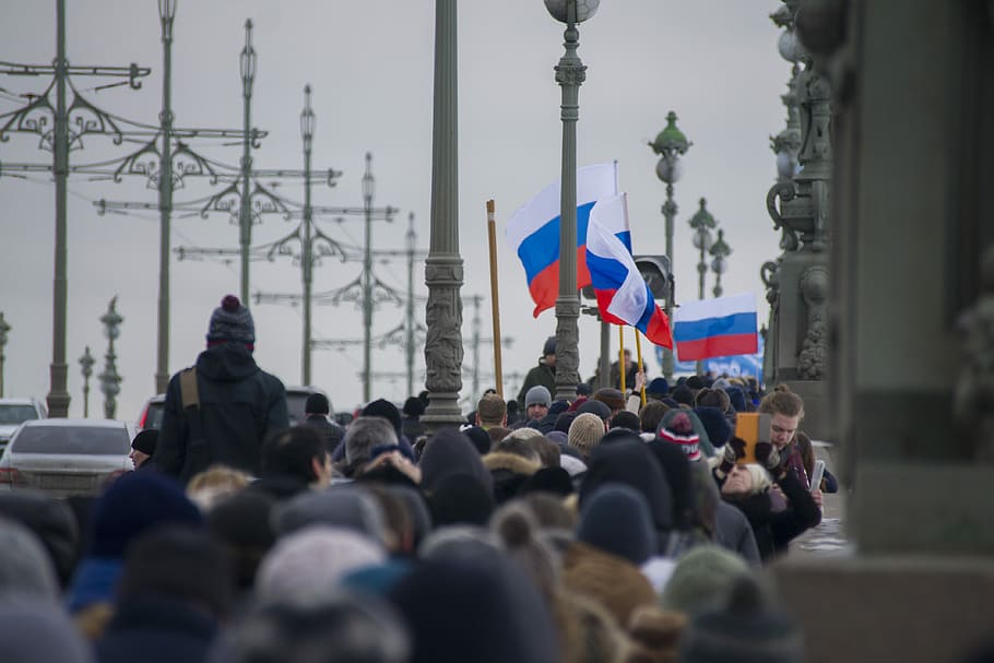 Russian Protest, group of people walking beside gray concrete posts HD wallpaper