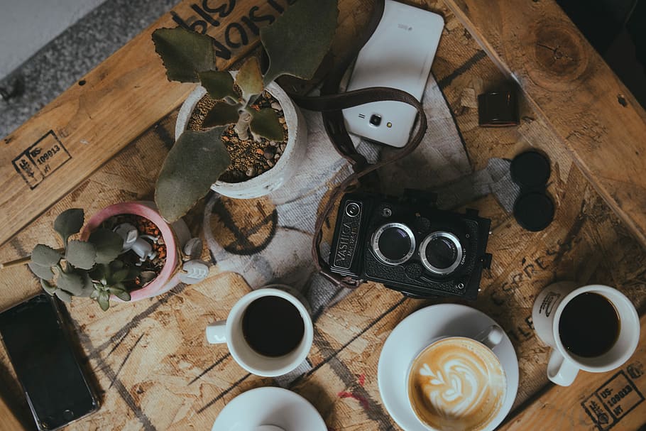 flat lay photo of coffee and camera, white ceramic mug with coffee on table HD wallpaper