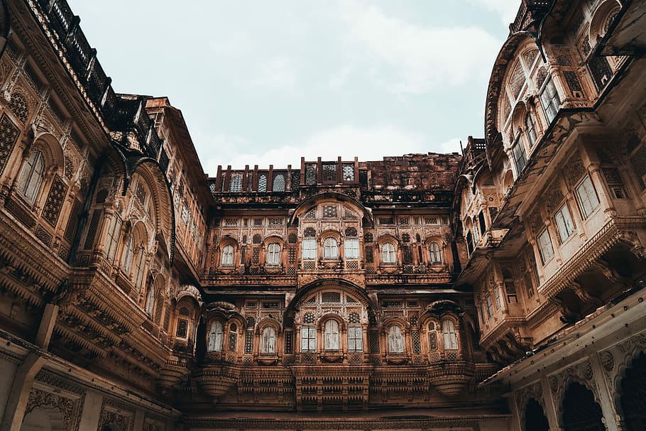 architectural photography of building, groundview photo of brown building HD wallpaper