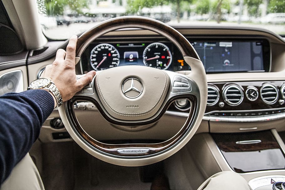 person sitting in Mercedes-Benz driver seat, person sitting inside Mercedes-Benz car holding steering wheel, HD wallpaper