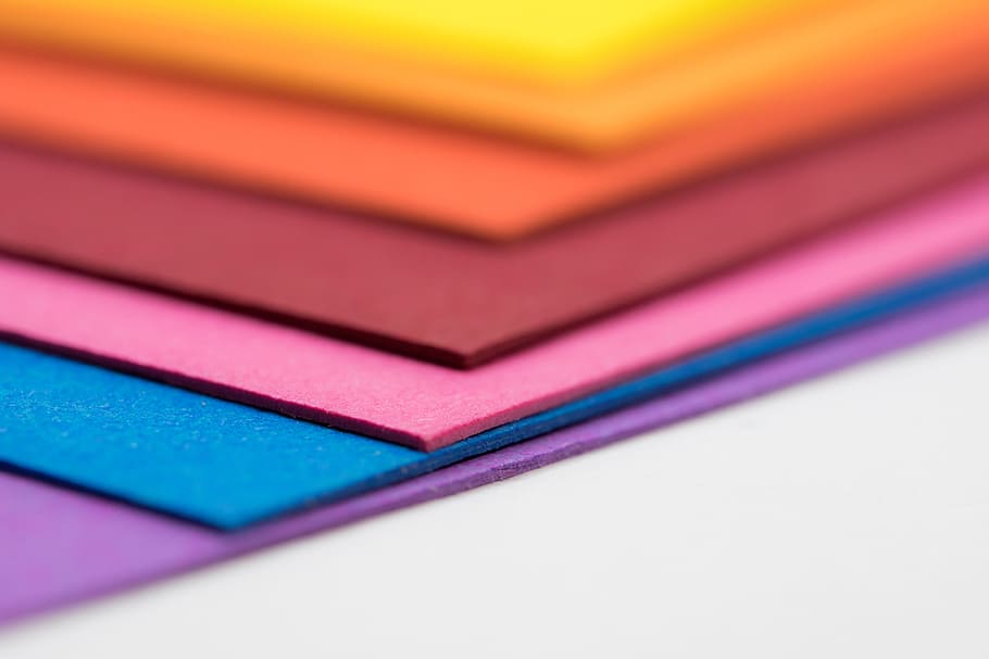 tilt shift photo of assorted-color papers, cardboard, white surface HD wallpaper
