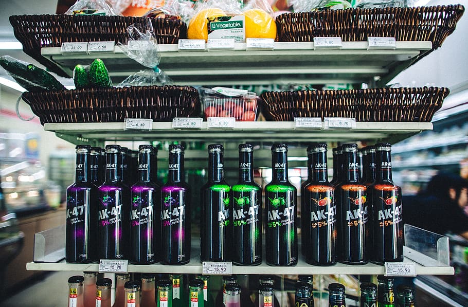 shallow focus of glass bottles, liquor bottles on white shelf HD wallpaper
