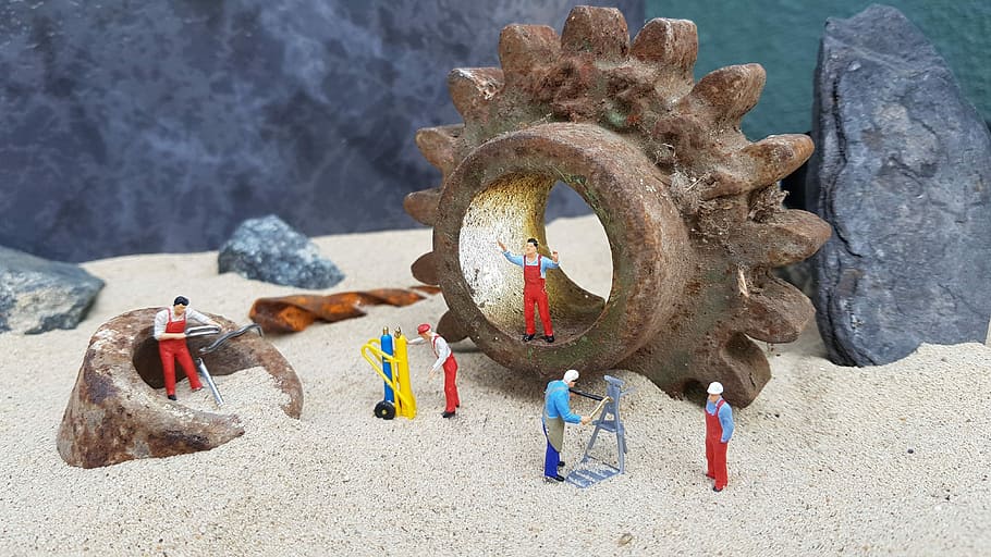several character figurines on sand, workshop, repair, miniature figures
