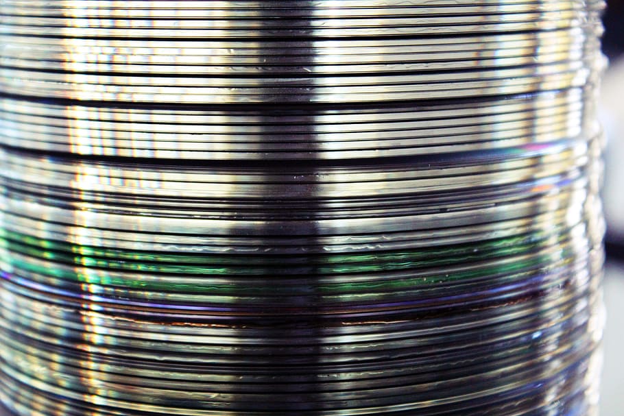 pile of DVD discs, cd cd rom, spindle, mirroring, compact disc HD wallpaper