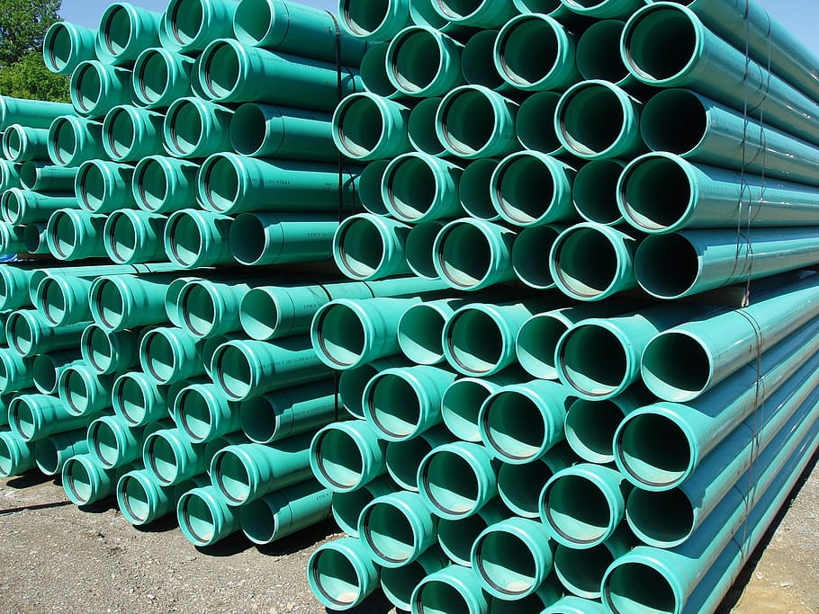 pile of teal pipe lot, green, plastic, pipes, culvert, water