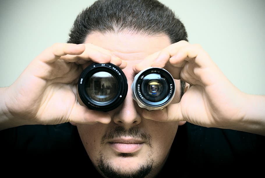 man wearing black shirts holding DSLR camera lens, portrait HD wallpaper