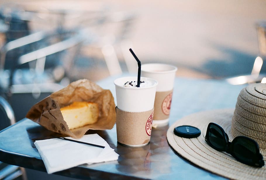 selective focus photography of bread and sip bottle on table, two white coffee cup on tabletop HD wallpaper