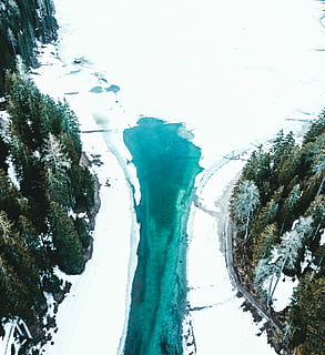green paint under white clouds, aerial photography of body of water during snow HD wallpaper