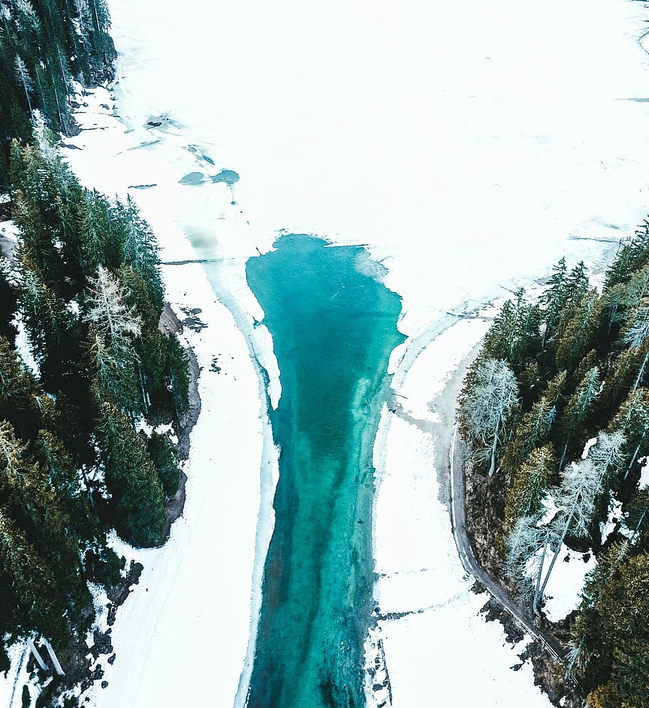 green paint under white clouds, aerial photography of body of water during snow HD wallpaper