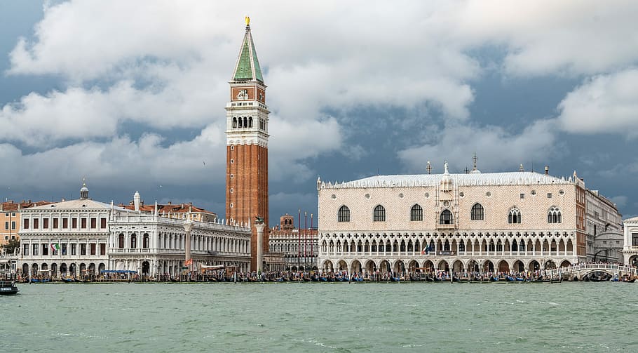 beige concrete building during daytime, landscape photography of St. Mark's Campanell and Doge's Palace in Venice