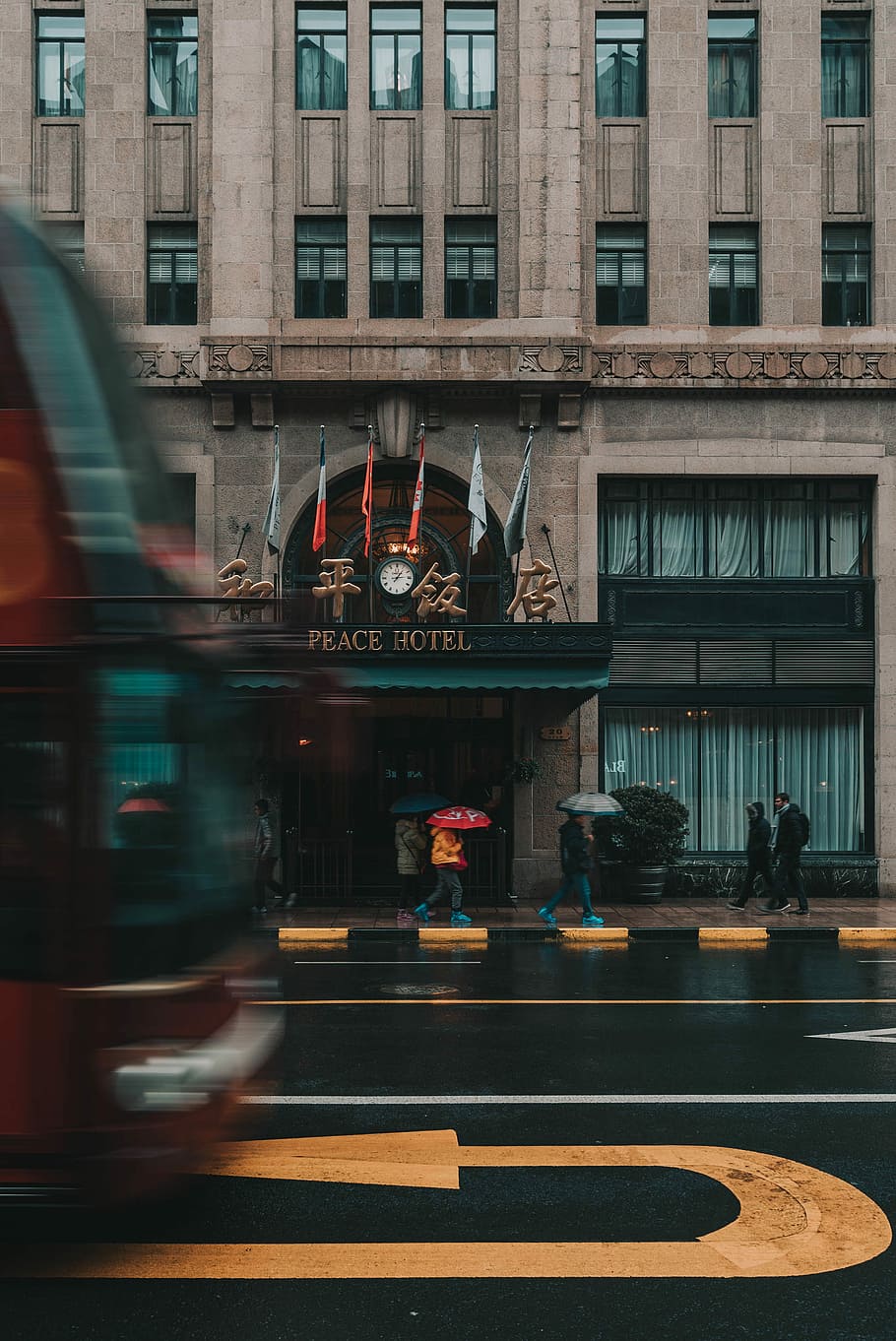 people walking on pathway beside Peace Hotel, Peace Hotel near pavement HD wallpaper