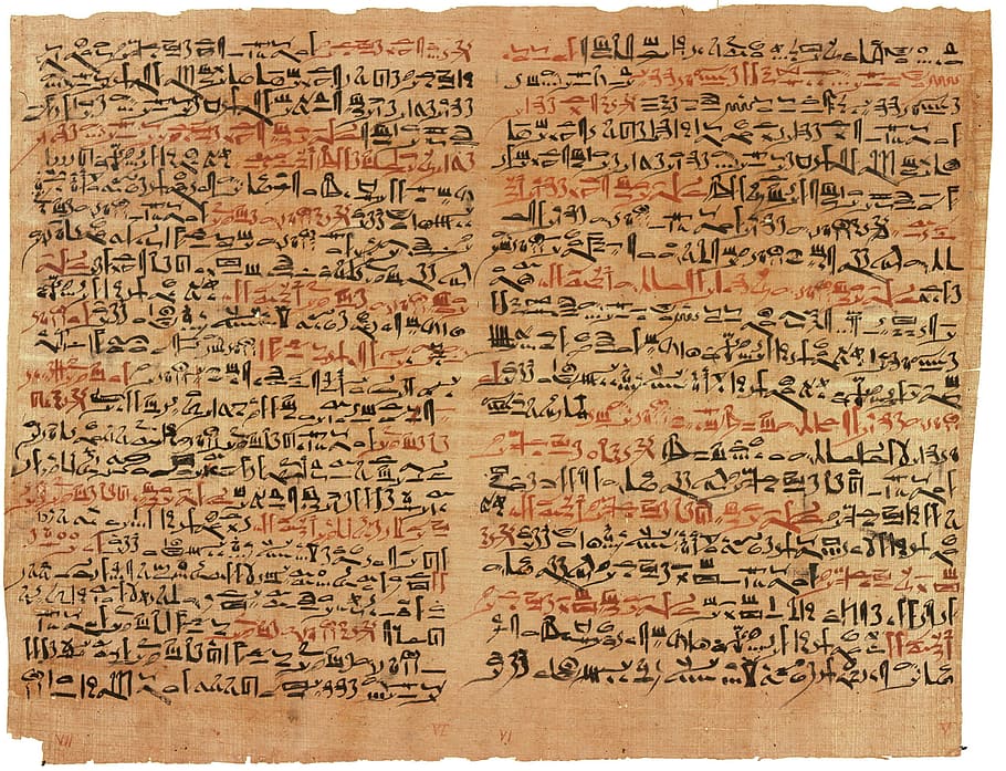 black and red text on textile, brown, paper, papyrus, hieroglyphics