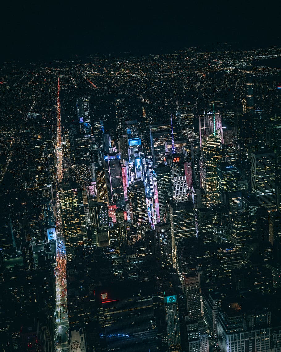 aerial view of city buildings during night time, bird's eye view of buildings during night