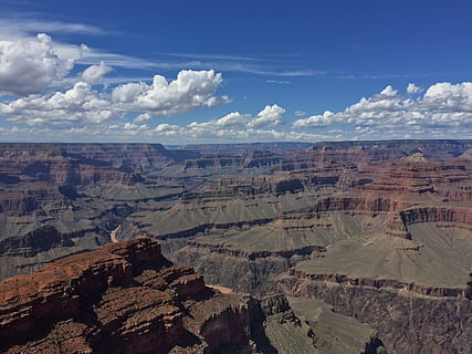 aerial photo of brown and grey mountains under blue cloudy sky photo taken during daytime, photography of Grand Canyon HD wallpaper