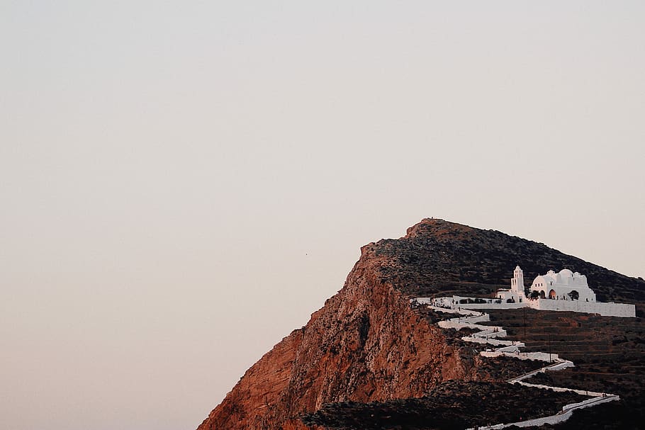 photo of white building on hilltop, white concrete building on top of mountain under white sky during daytime HD wallpaper