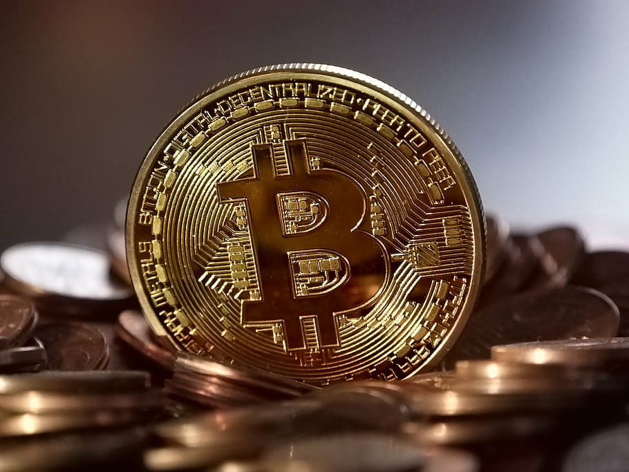 shallow focus photography of gold-colored bitcoin coin, money