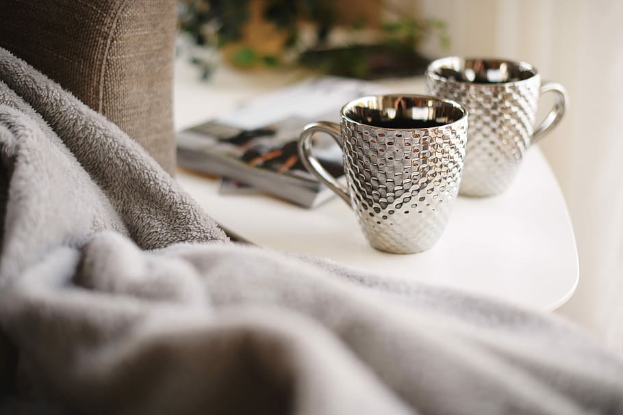 two silver mugs on white side table, two white-and-silver mugs on table HD wallpaper