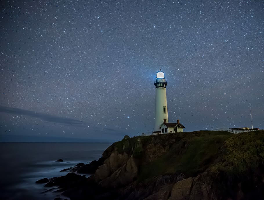 white light house near body of water, lighthouse near water, stars HD wallpaper