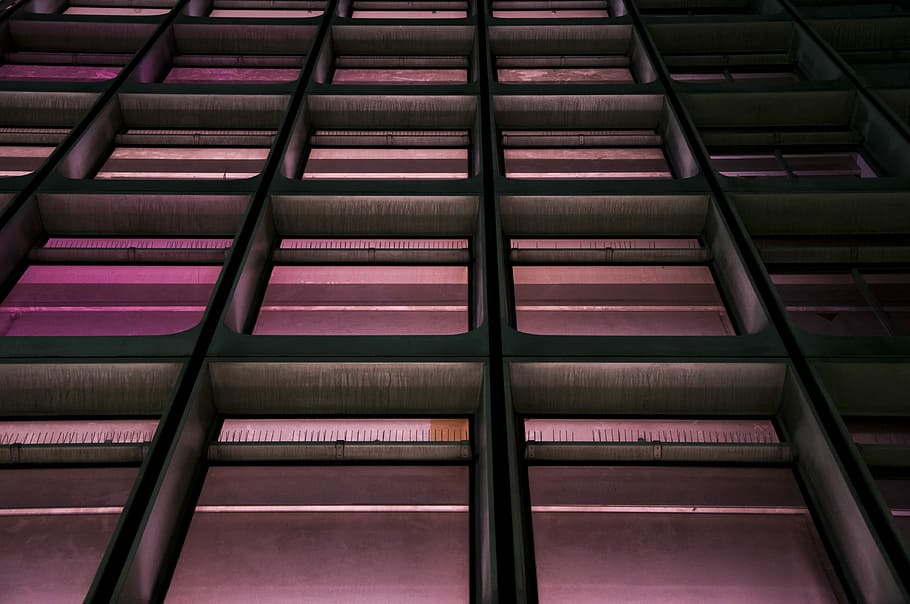 low-angle photo of building with pink lights, low angle photography of concrete building HD wallpaper