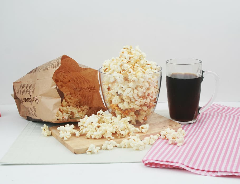 puffcorns in clear glass bowl on table, snack, popcorn, cola HD wallpaper