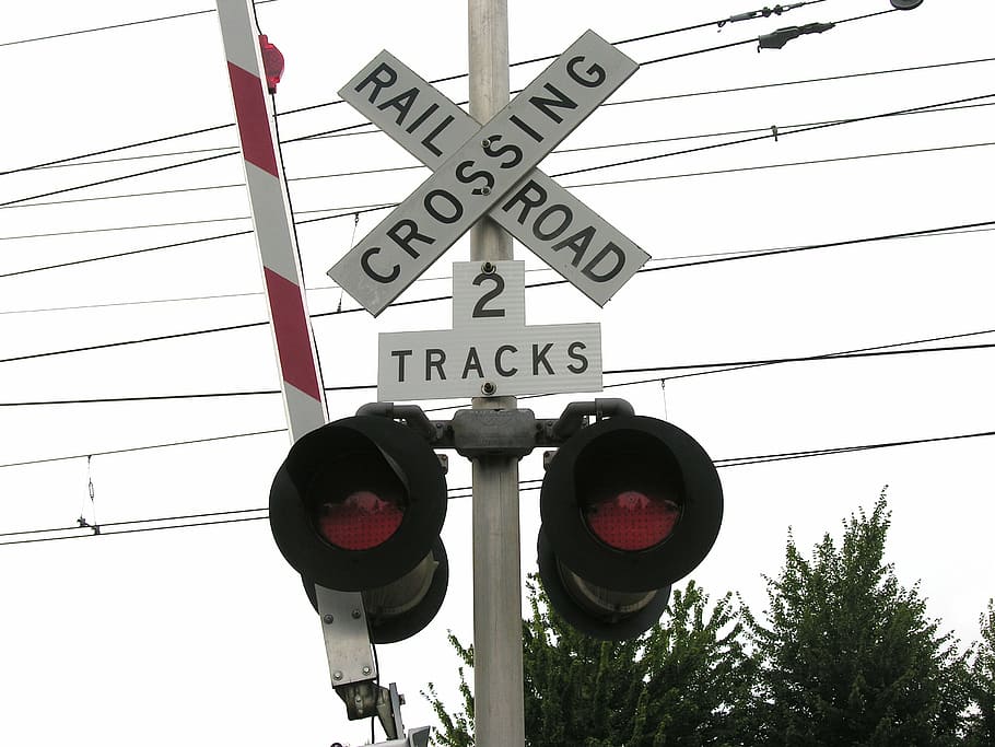 railroad crossing sign, railroad sign, stoplight, street, traffic