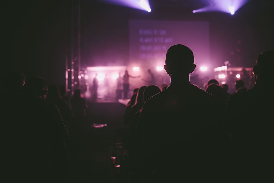 photo of man facing on stage, silhouette of people watching band on stage, HD wallpaper