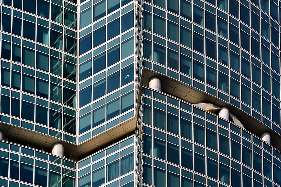 blue building, gray concrete multi-story building at daytime HD wallpaper