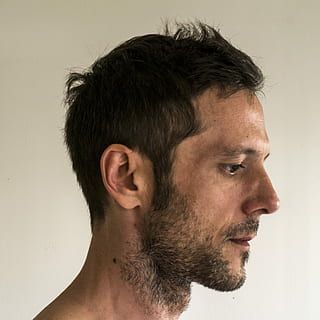 man standing near white wall, head, profile, face, male, person HD wallpaper