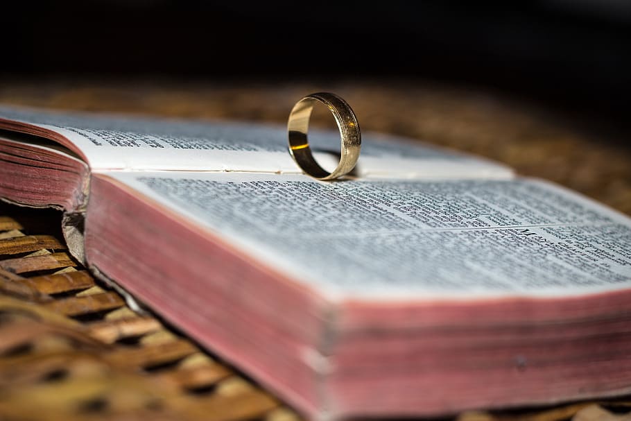 gold-colored ring on opened Bible selective focus photo, wedding HD wallpaper