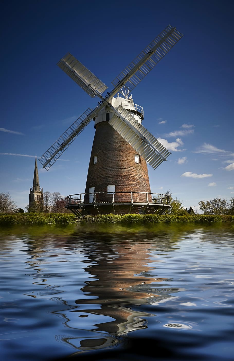 brown windmill beside the body of water, church, agriculture