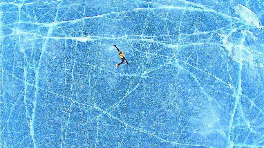 person falling on blue surface, bird's-eye view photography of person skiing in the frozen lake HD wallpaper
