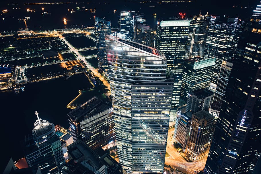aerial view of high-rise building, aerial photography of city high-rise buildings at nighttime HD wallpaper