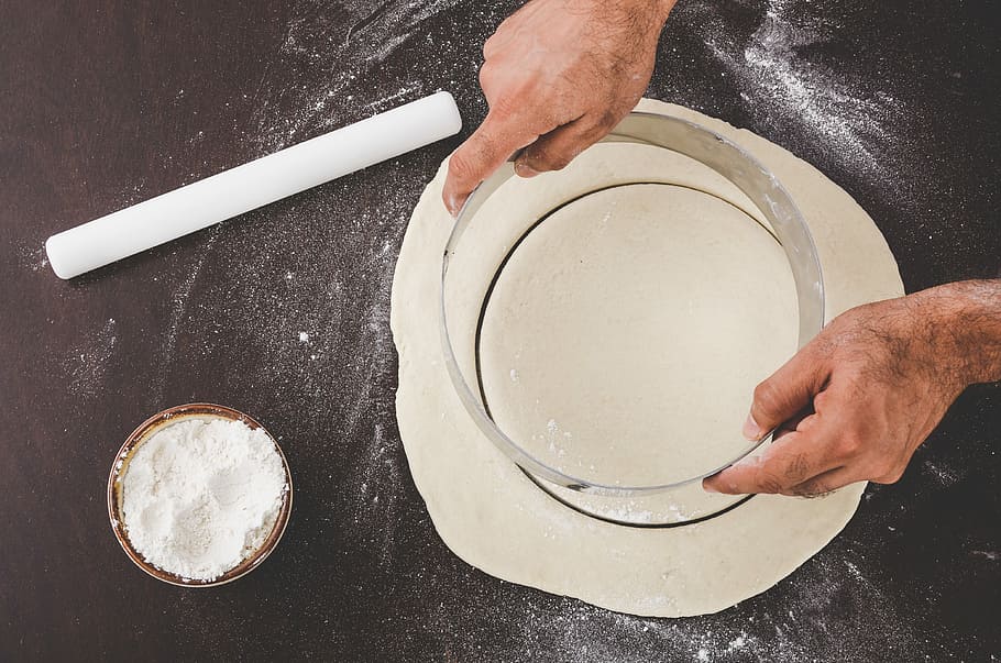 person holding gray steel frame, person holding dough cutter HD wallpaper