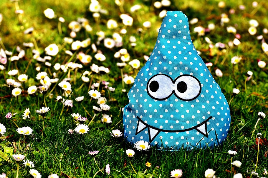 blue and white monster plush toy on daisy flowers at daytime, HD wallpaper