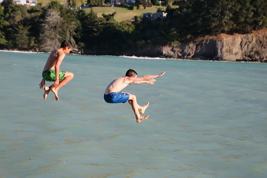 two boys jumping on body of water, child, activity, active HD wallpaper