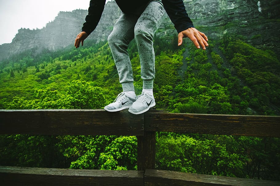 man standing on rail and mountain at distance, jump, leap, perch HD wallpaper