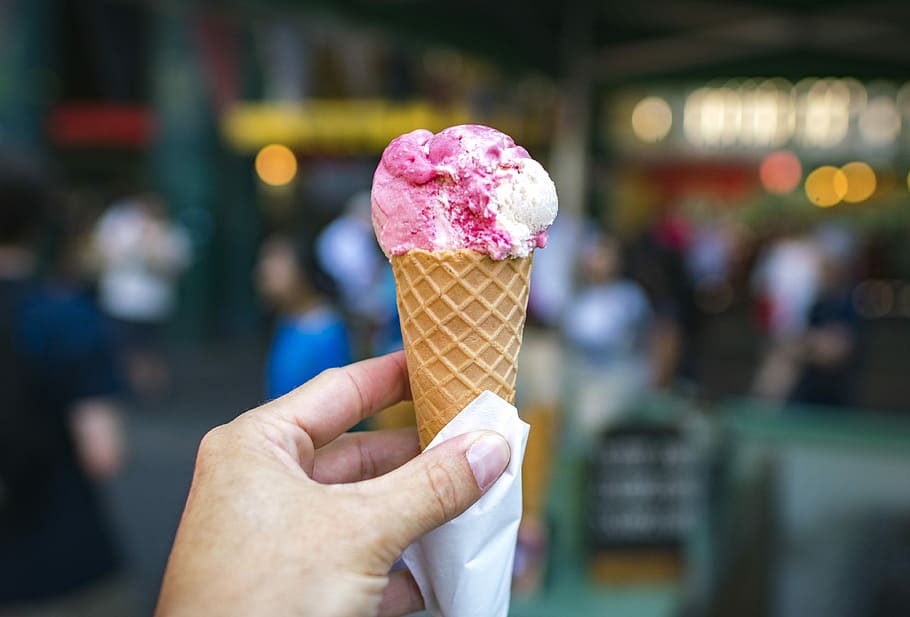 person holding white and pink ice cream in cone shallow focus photography, person holding cone soft cream HD wallpaper