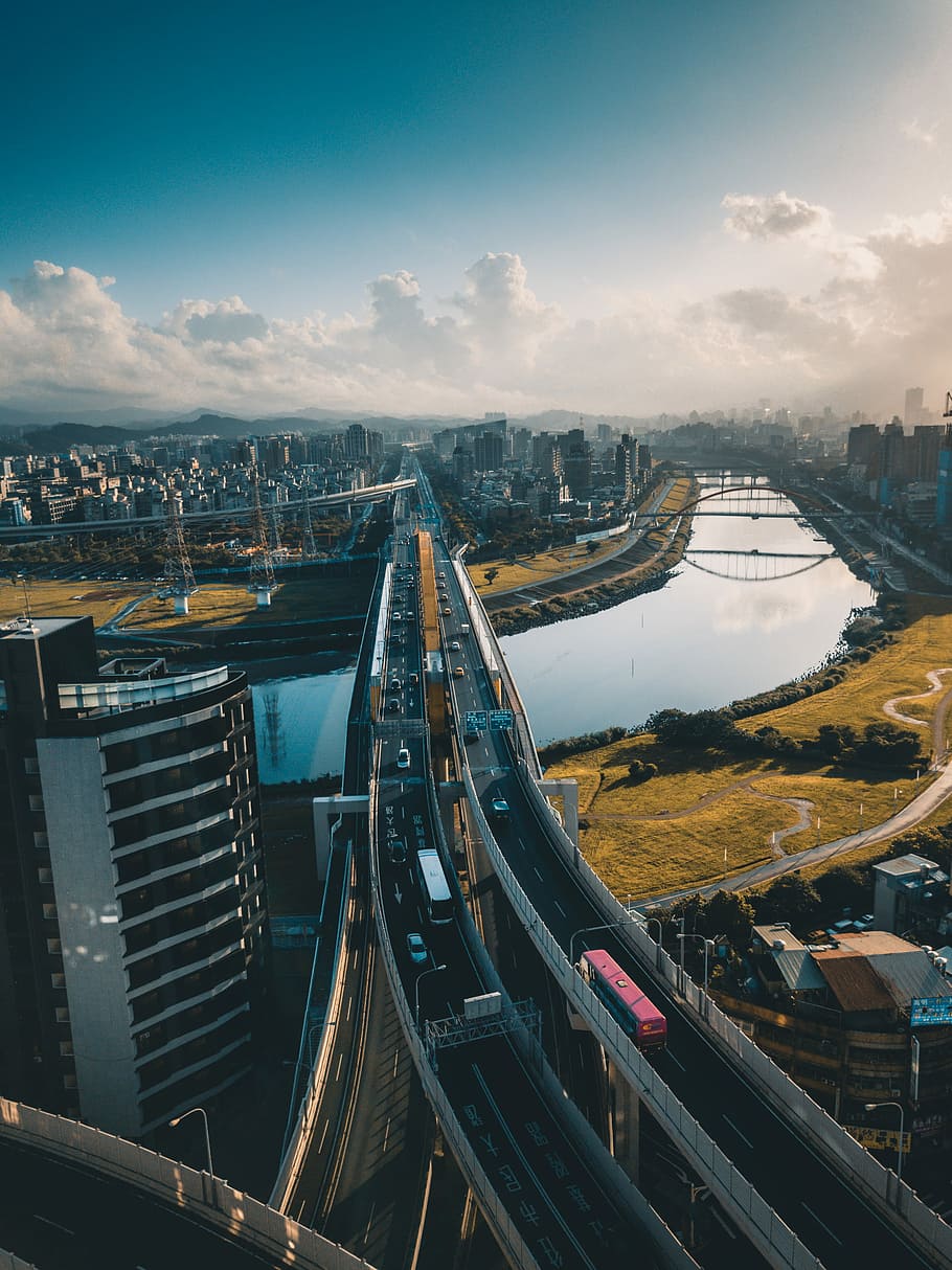 Urban Discovery, aerial photography of bridge near buildings at daytime HD wallpaper