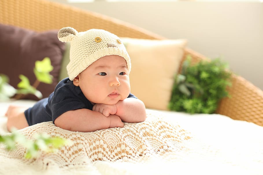 baby wearing beige beanie hat, 50 days, profile, cap, pillow, HD wallpaper