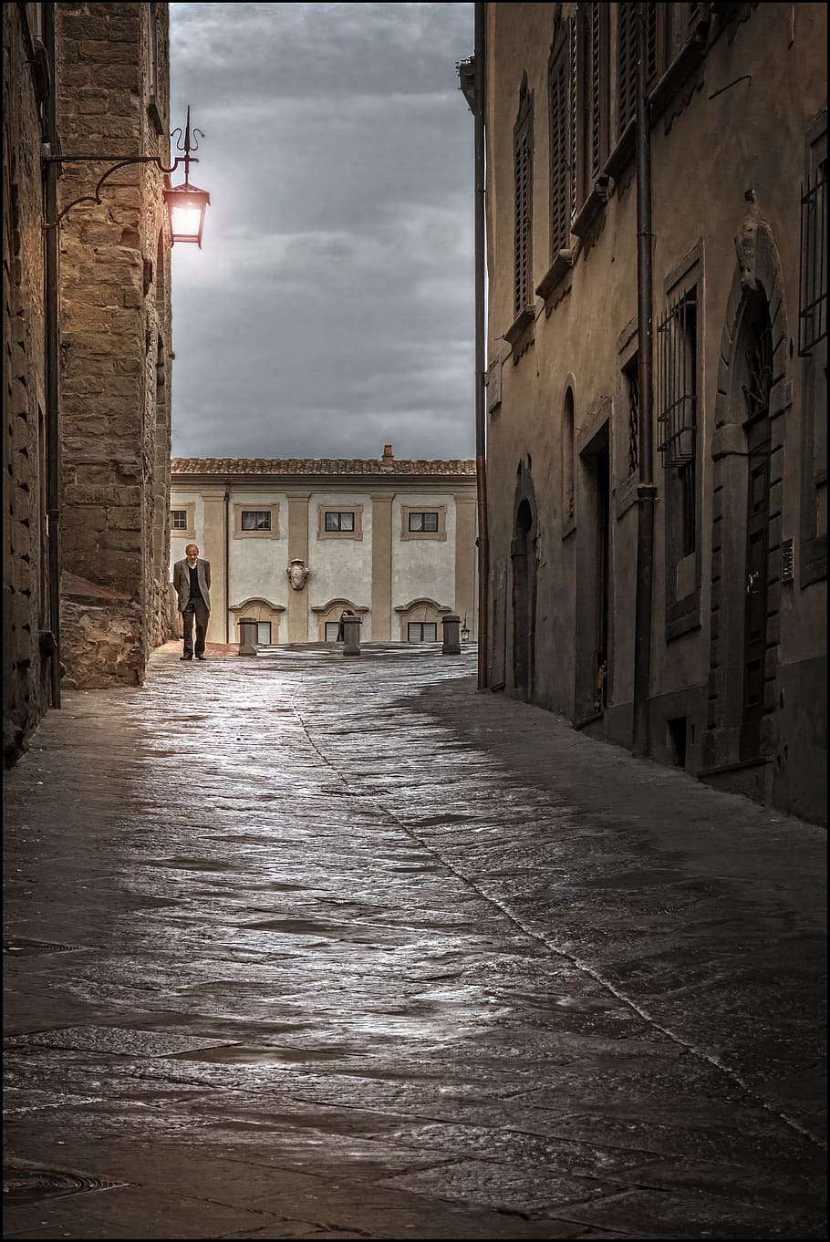 man walking on concrete road, architecture, old, rain, sunset HD wallpaper