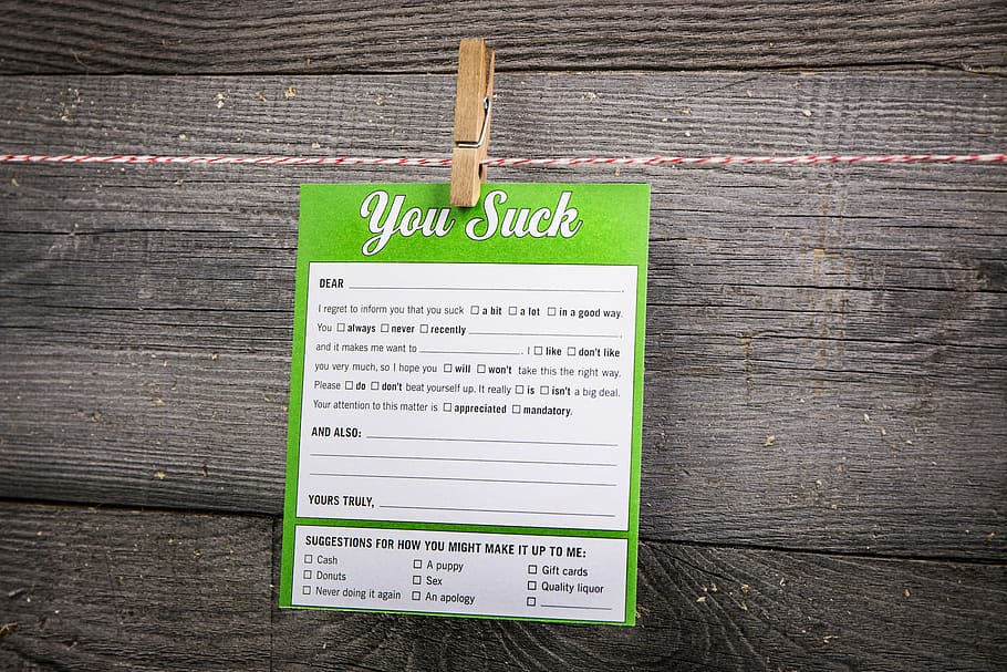 You Suck tag clipped on clothes line, letter, clothespin, message HD wallpaper