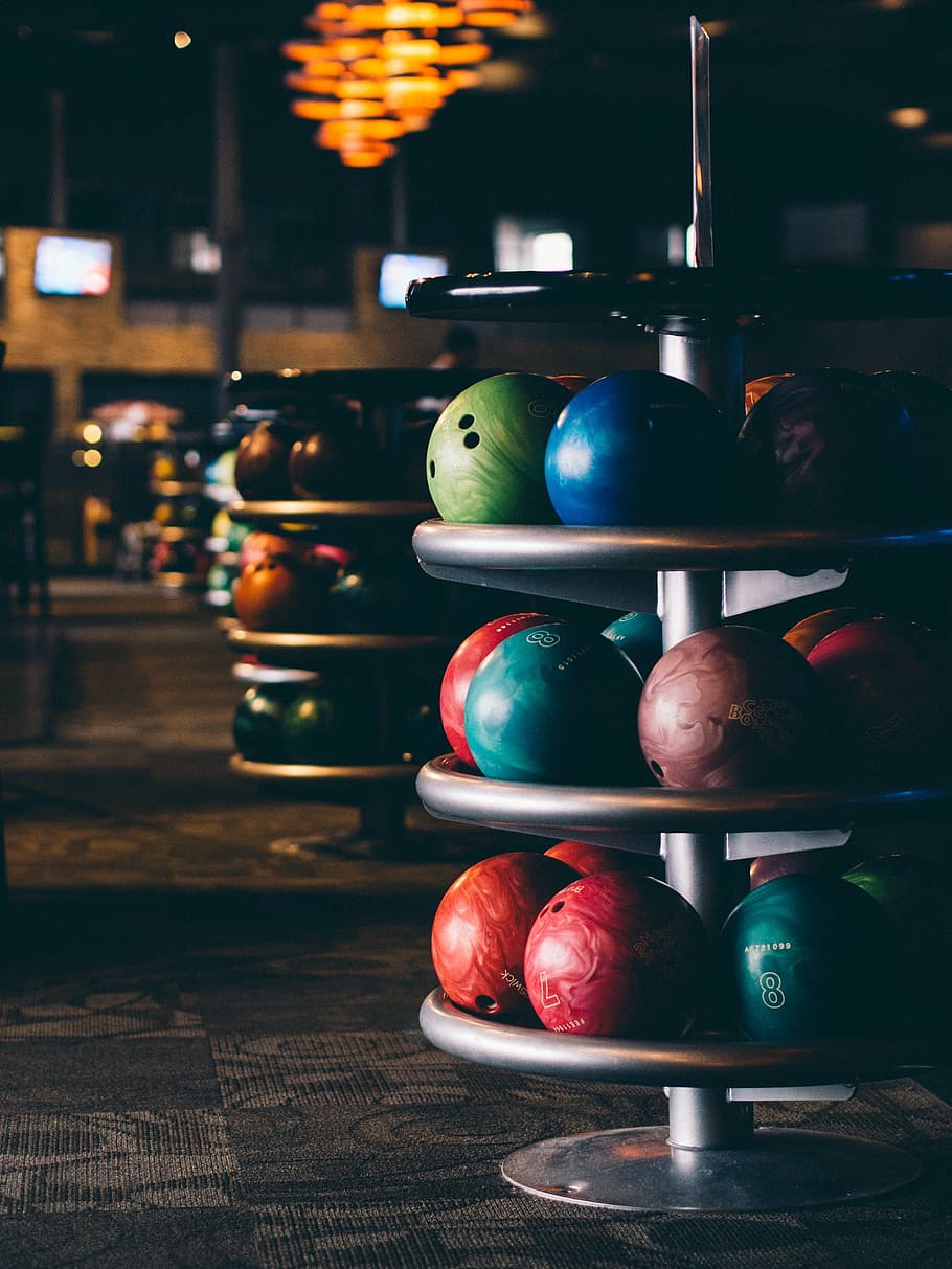 selective focus of assorted-color bowling balls on rack, blur, HD wallpaper
