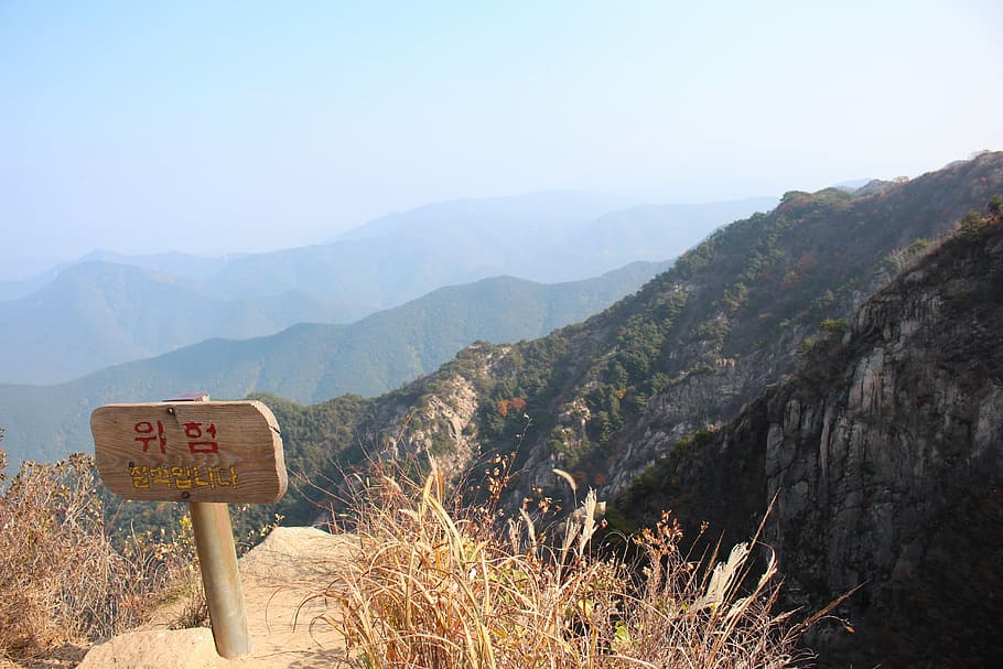 mountain, cliff, warning, landscape, communication, sign, text HD wallpaper
