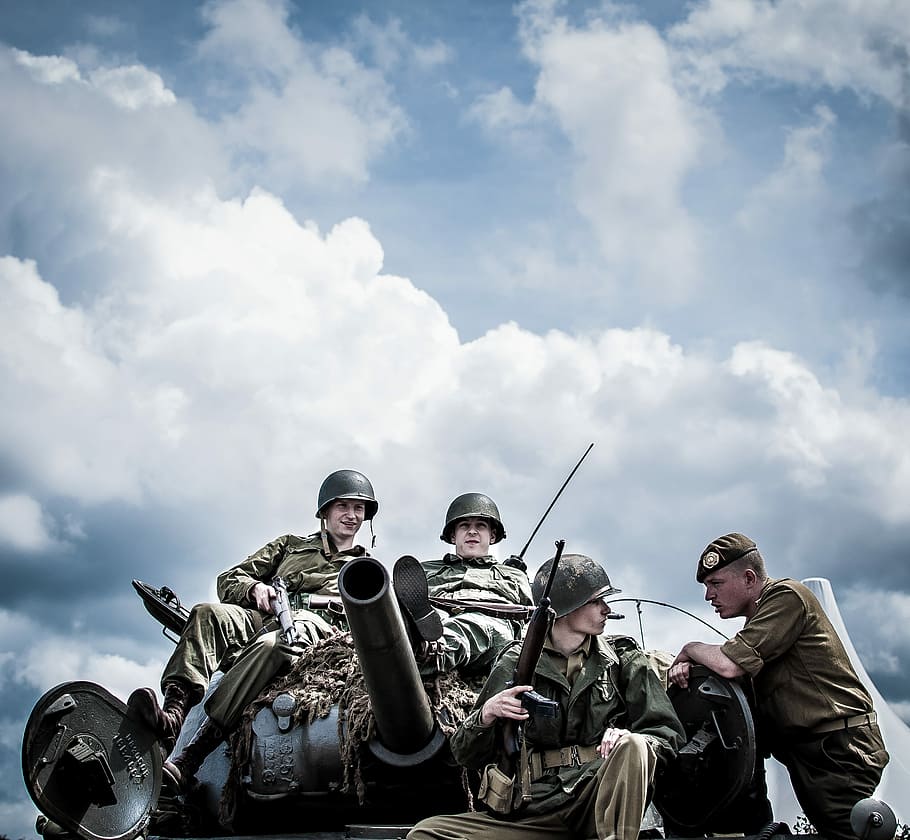 four men sitting on tank under cloudy sky, man, male, soldier, HD wallpaper